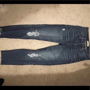 Distressed Madewell skinny jeans.